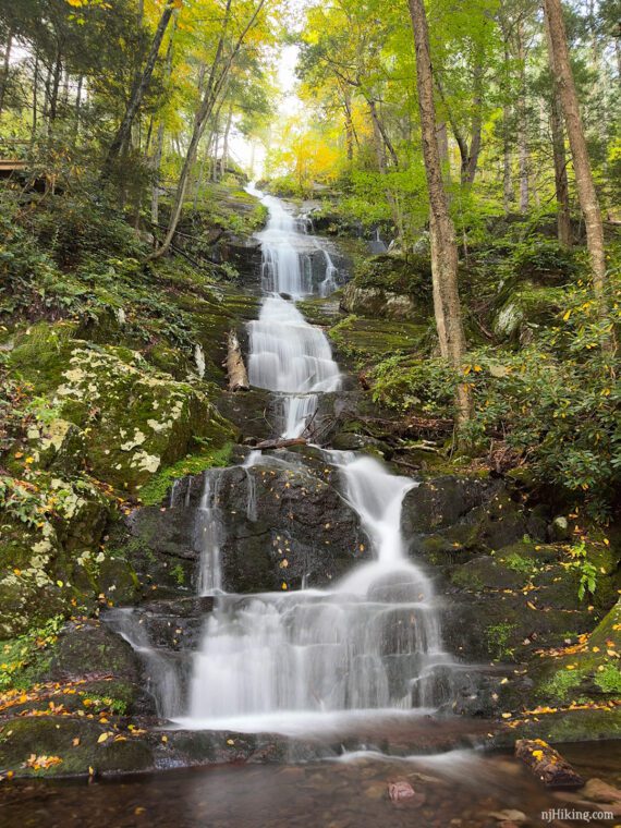 Buttermilk Falls with a lot of water flowing over the rocks.