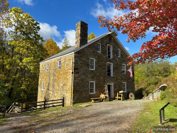 Cooper Mill with red foliage in front of the building.