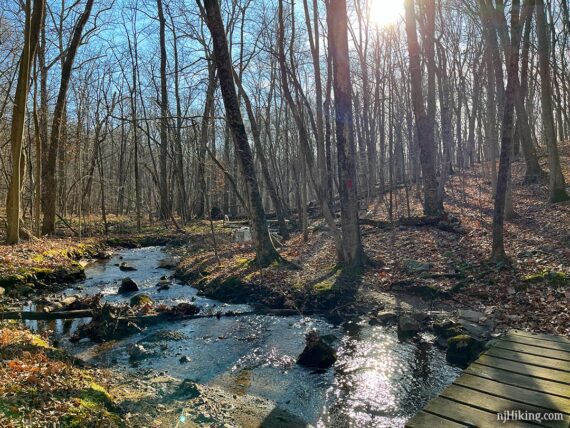 Wooden bridge over a brook.