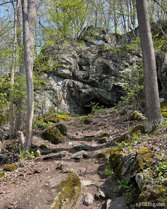 Small cave in a large rock face.