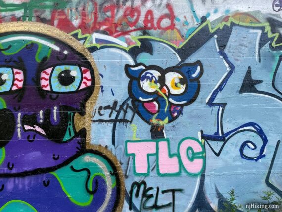 Close up of a section of graffiti on a concrete structure.