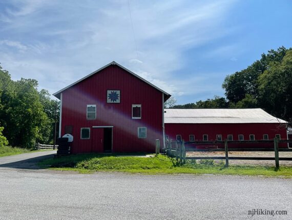 Red barn at a trail parking area.