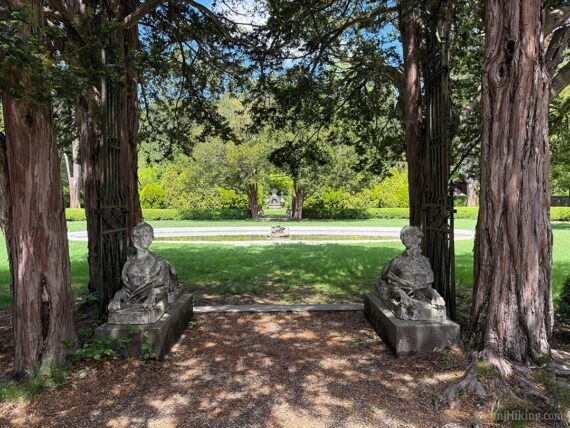 Ringwood Manor sculptures by trees.