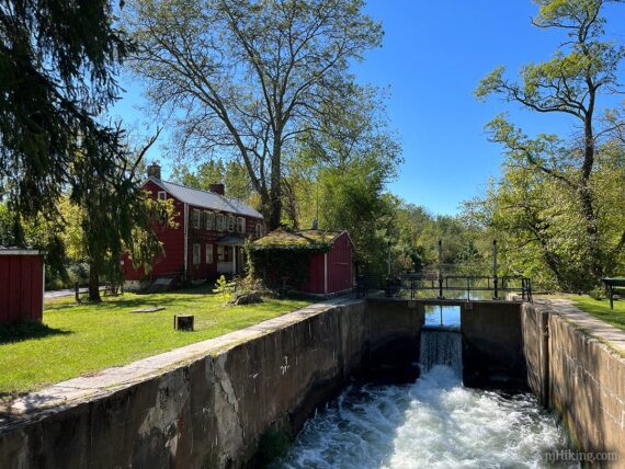 Canal lock on the D&R Canal with old building.