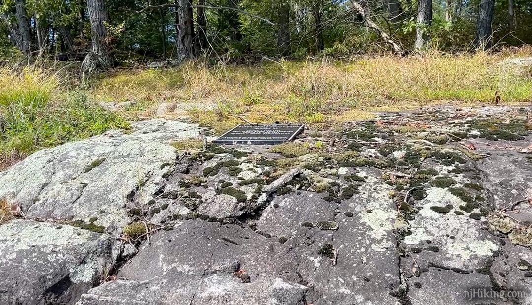 Black Eagle camp plaque on a rock.